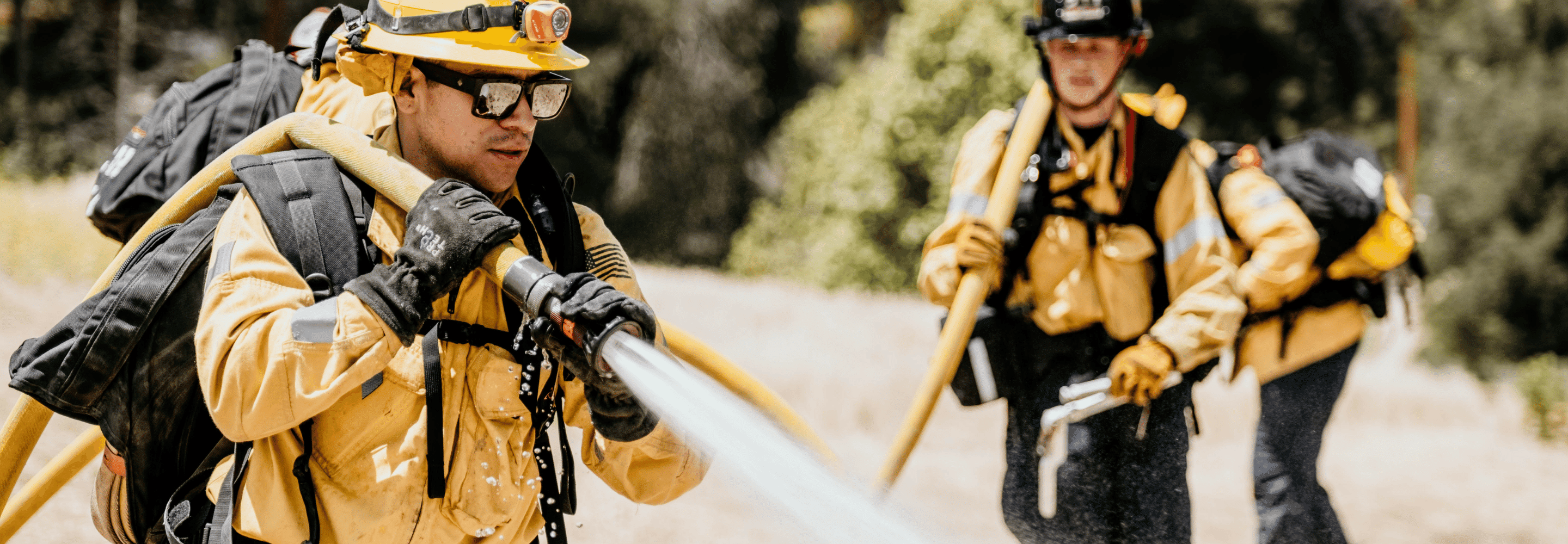 A Chino Valley Fire District Firefighter Waters a Wildland Fire Hotspot