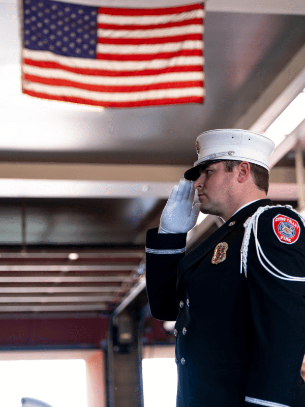 Soluting Firefighter in Dress Uniform