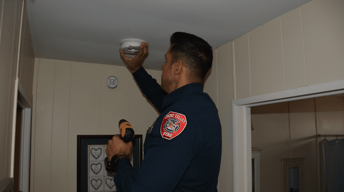 Chino Valley Firefighters install a Smoke Alarm at a 55+ Community Home